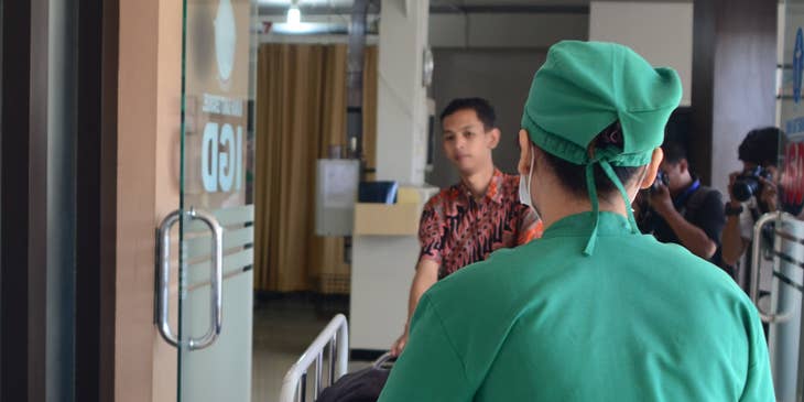 ED tech transporting patients around the hospital on a stretcher.