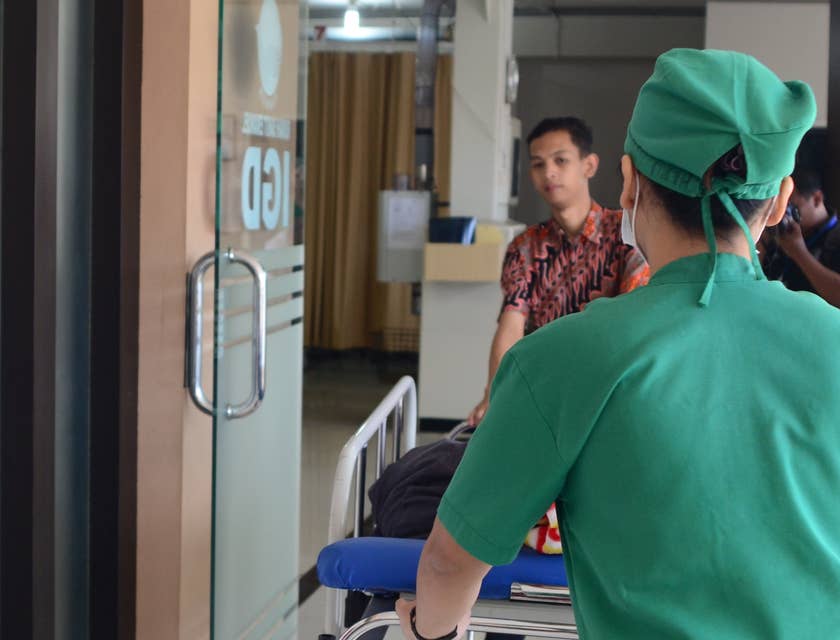 ED tech transporting patients around the hospital on a stretcher.