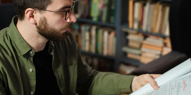 An editor reviewing scripts.