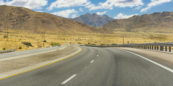 A view of the mountains and an empty road in El Paso, Texas.