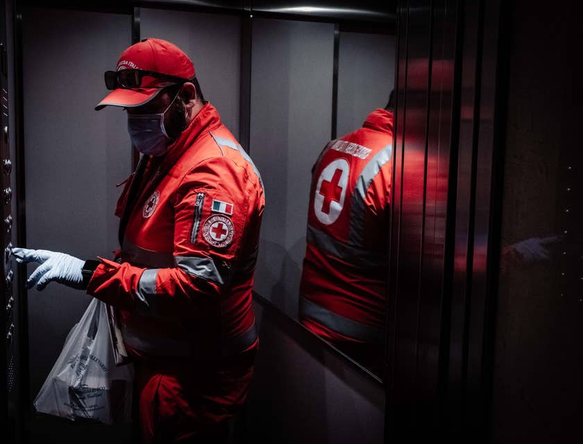 male Emergency Management Specialist pushing the elevator button on the way to emergency headquarters after a day's work