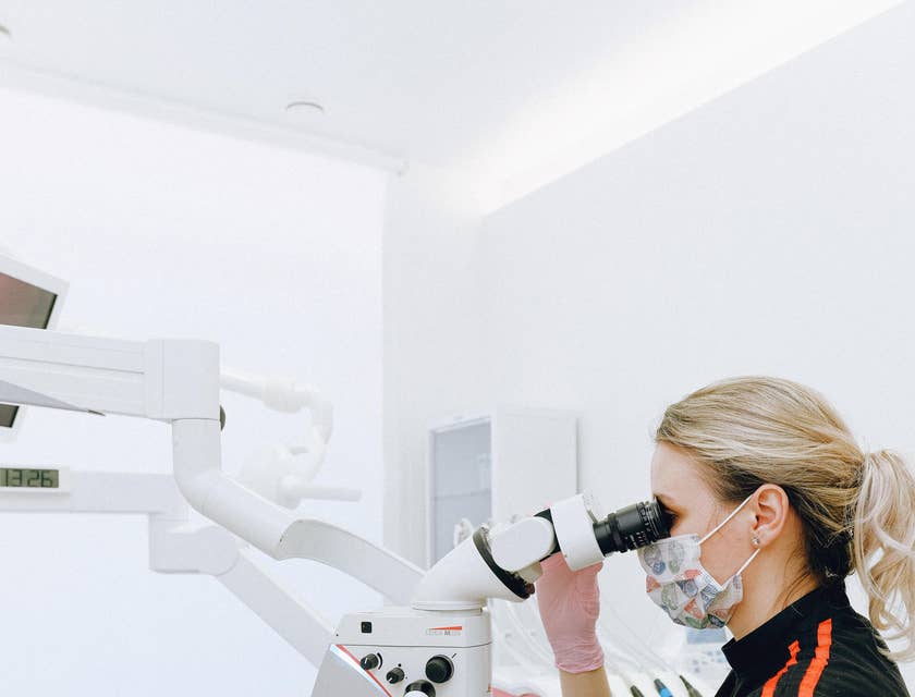 Endodontist utilizing dental instruments to determine the cause of patients' oral pain.
