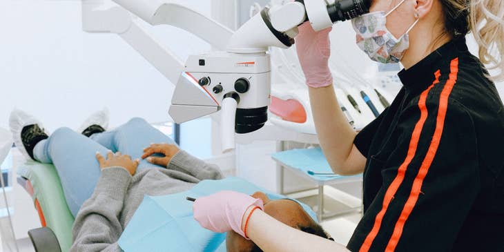 Endodontist utilizing dental instruments to determine the cause of patients' oral pain.
