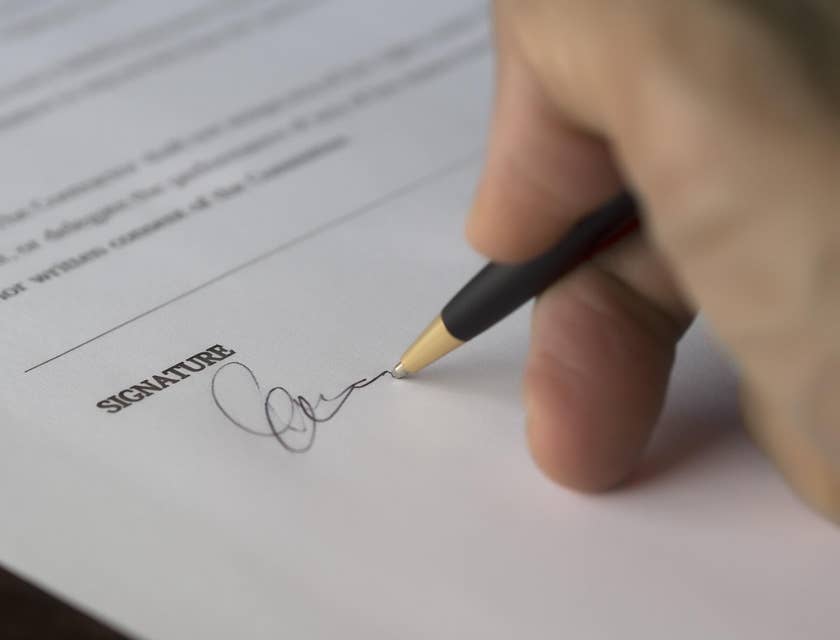 Person signing an equal opportunity employer statement.