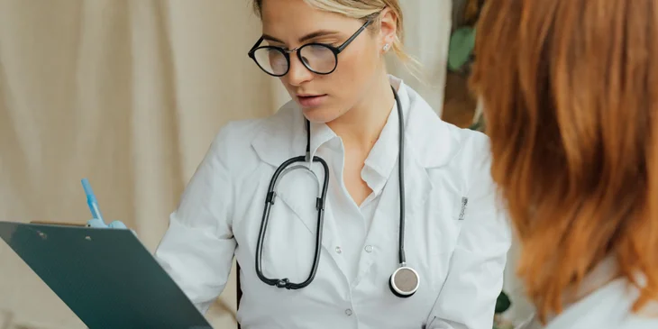 An ER doctor examines a patient as soon as it arrived at an emergency room.