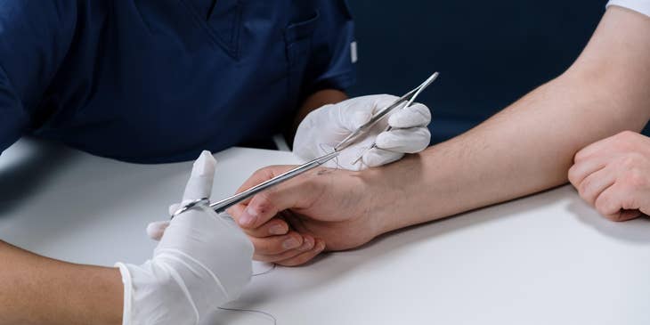 ER Nurse performing a minor operation.