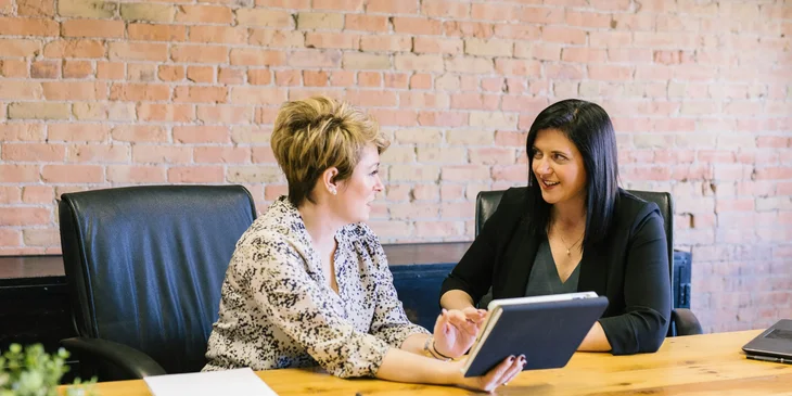 An ERP consultant giving her insight to a client regarding a software her company wishes to use.