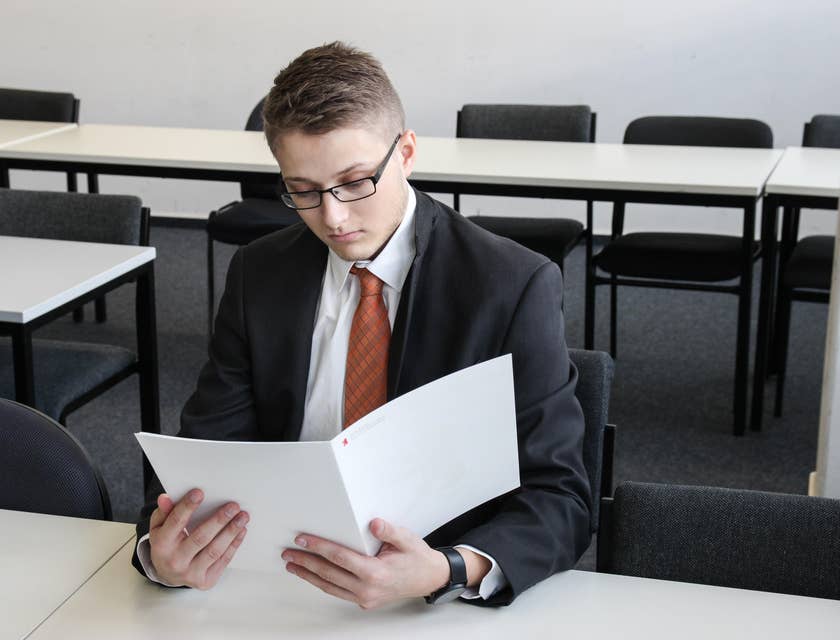 Escrow Officer preparing clients legal documents for sale closure