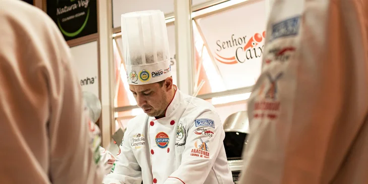 An executive chef training new members of his team.