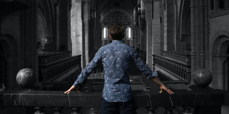Executive Pastor standing inside the church checking its interior