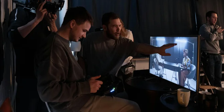 An executive producer working with his production team.