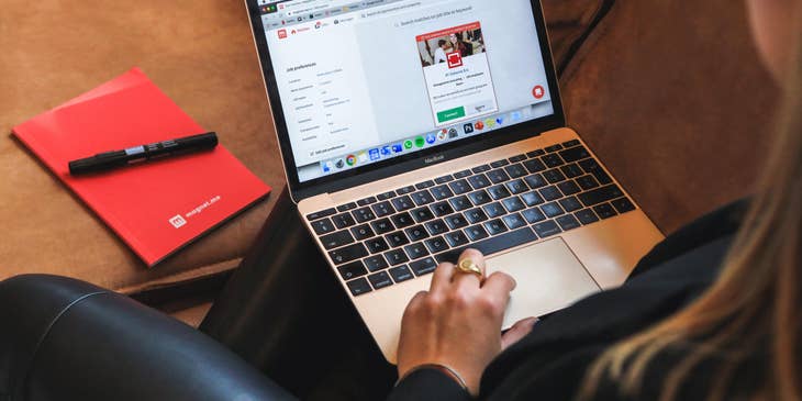 A Female Executive Recruiter on her laptop on a job posting site.