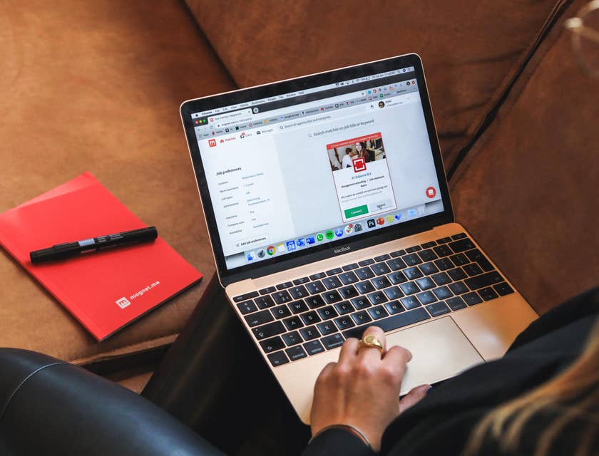 A Female Executive Recruiter on her laptop on a job posting site.