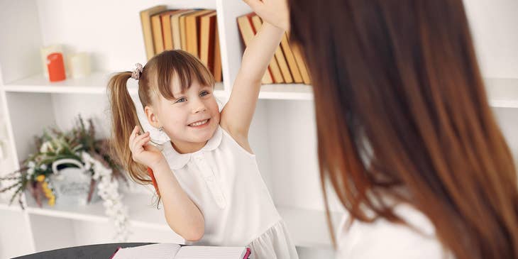 female Family Advocate interacting with a child for evaluation purposes