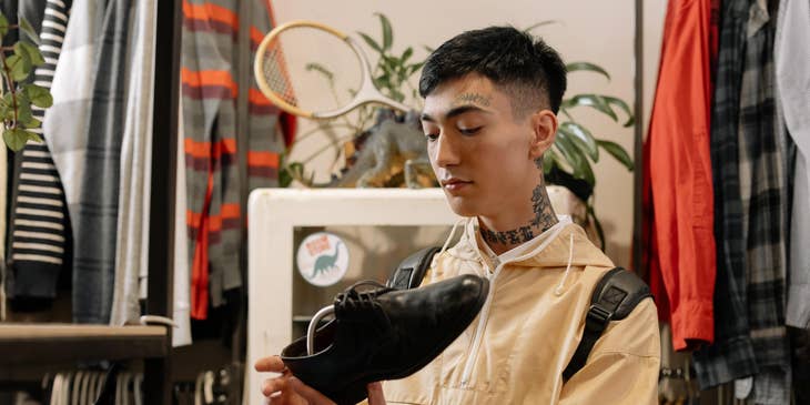 Fashion Editor checking out shoes on a fashion shop to stay informed on what is trending