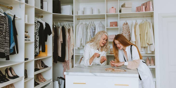 Fashion Merchandiser showing a ring to the manager which she thinks will be the next trend