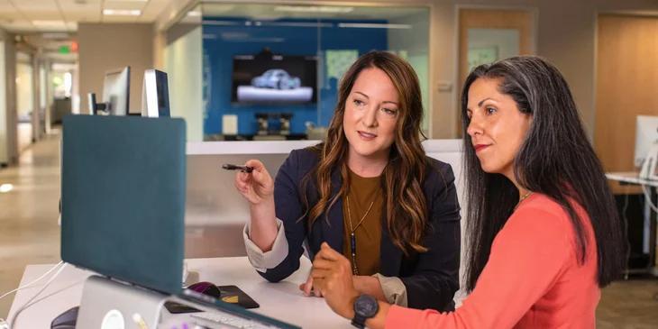 A financial counselor assisting a patient with financial applications.