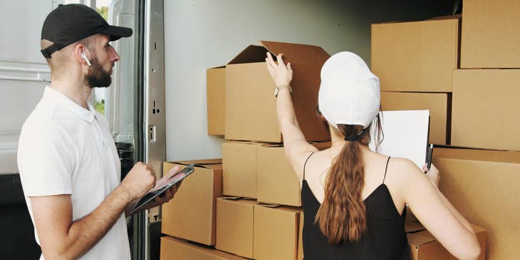 A female fleet manager assisting and teaching a new driver on how fleet services work.
