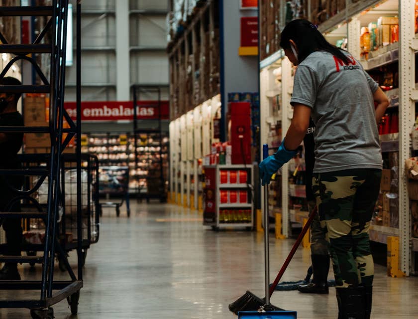 Floor tech cleaning a warehouse floor.
