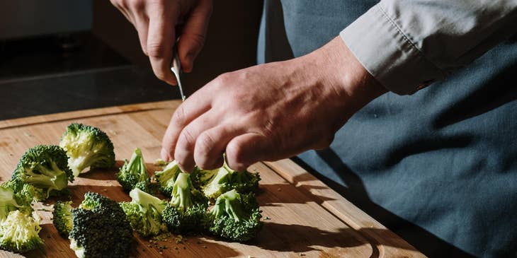 Food Preparation Worker slices the vegetables as instructed.
