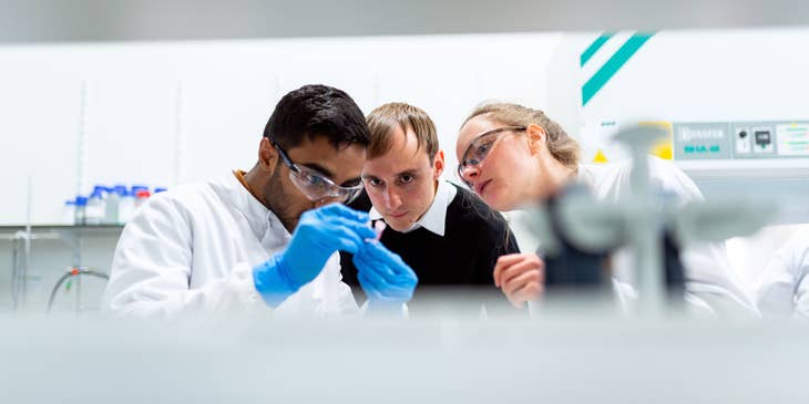 Food scientists conducting a lab test to determine the potential harm of the new product.