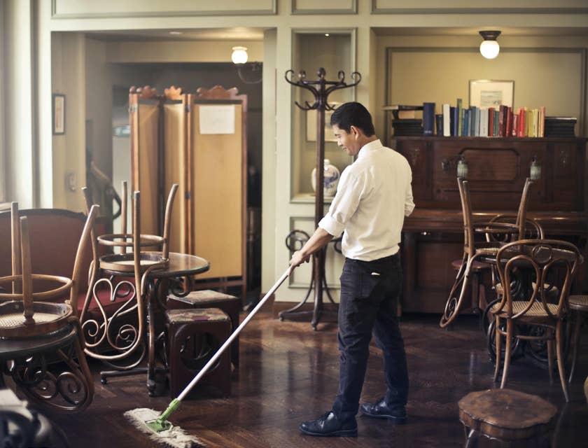 Food server mopping the floor after closing.