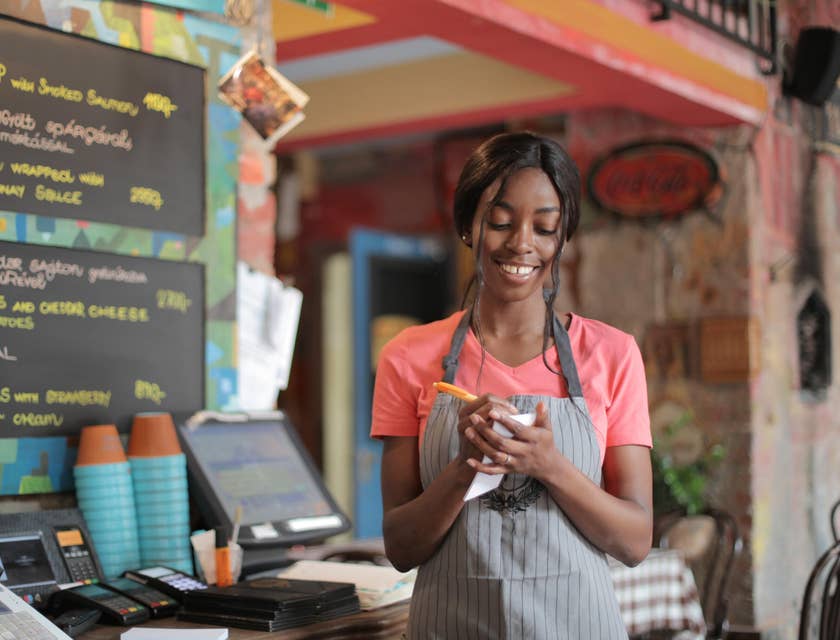 Food server ensuring accuracy of order before entering it into the system.