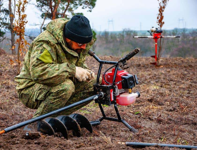 Forestry Technician setting up his equipment before conducting tests in the surrounding area.