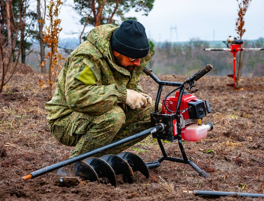 Forestry Technician setting up his equipment before conducting tests in the surrounding area