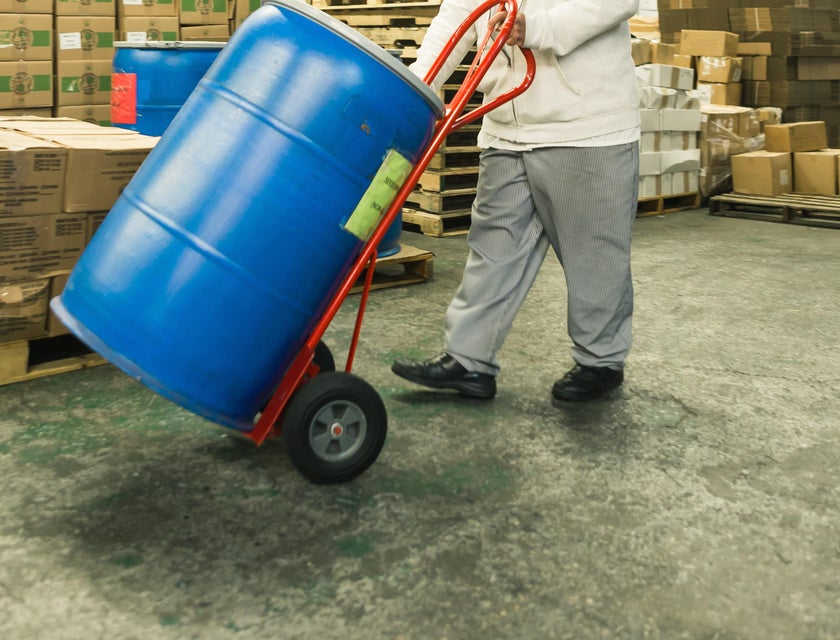 A Fulfillment Associate in a warehouse moving newly delivered merchandise to the designated storage area.