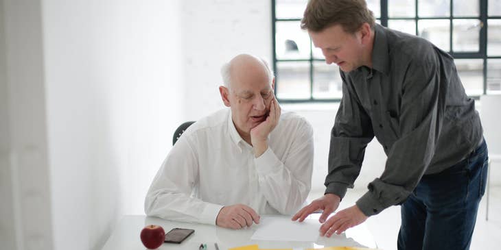 A funeral service manager providing the details of funeral service to a bereaved client.