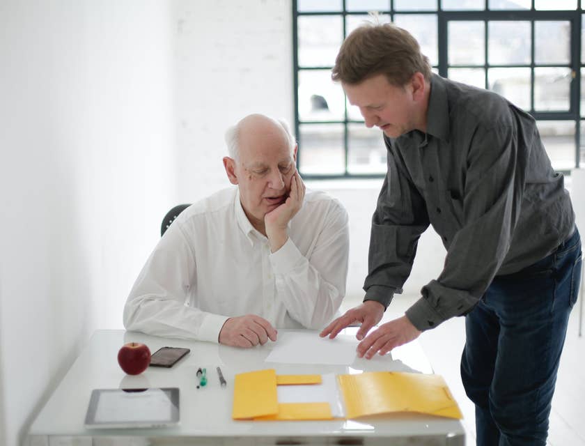 A funeral service manager providing the details of funeral service to a bereaved client.