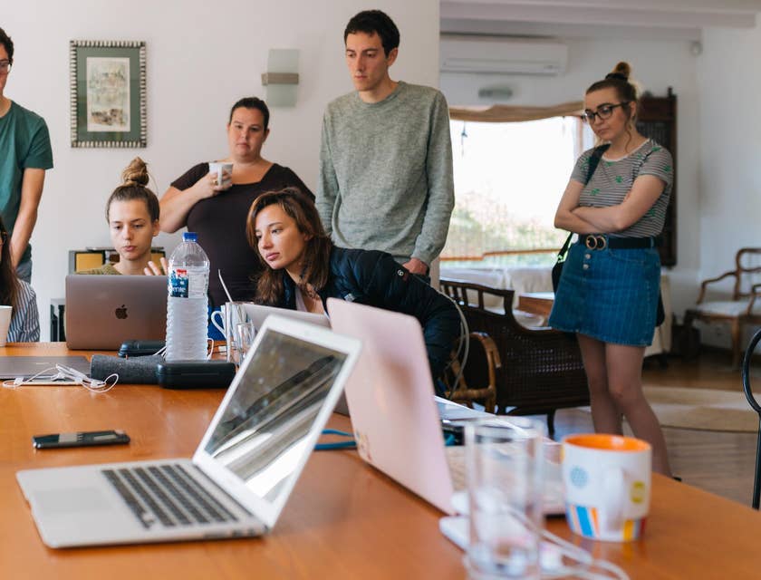 Group of young Gen Z people watching a laptop