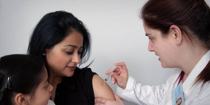 General Practitioner administering intramuscular injections.