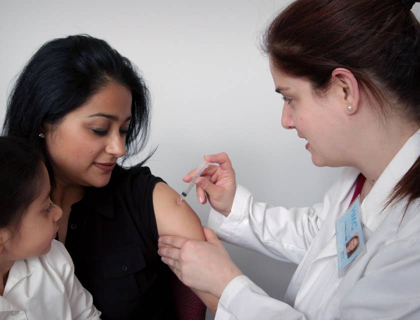 General Practitioner administering intramuscular injections.