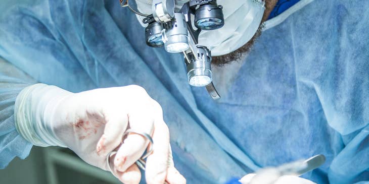 General Surgeon performs a surgical procedure on a young lady.