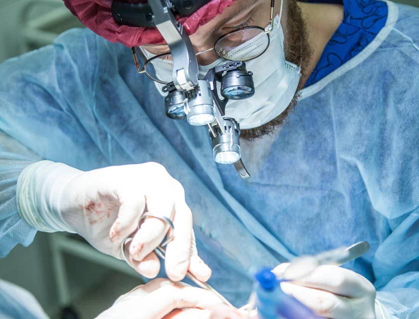 General Surgeon performs a surgical procedure on a young lady.