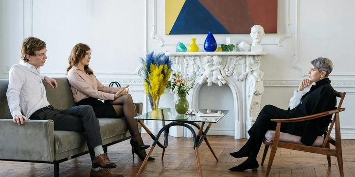 A genetic counselor provides supportive counseling to a couple.