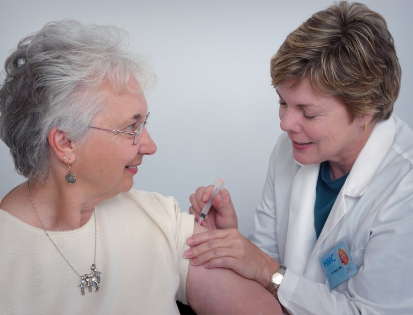 Geriatric Physician administering an intramuscular injection to an elderly.