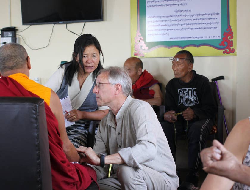 Gerontologist talking to some seniors.