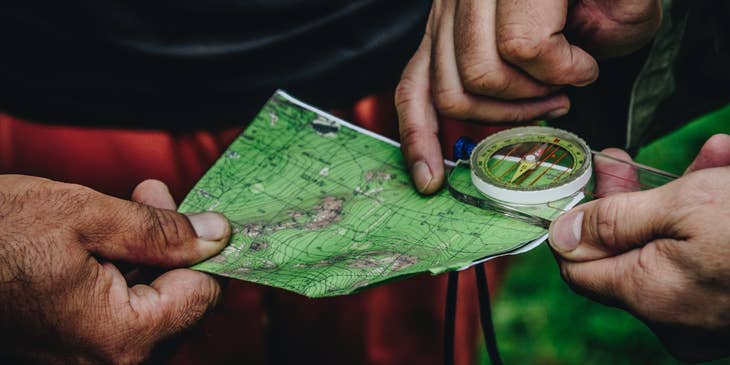 two men holding a map