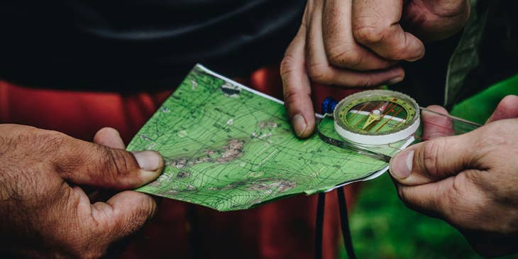 two men holding a map