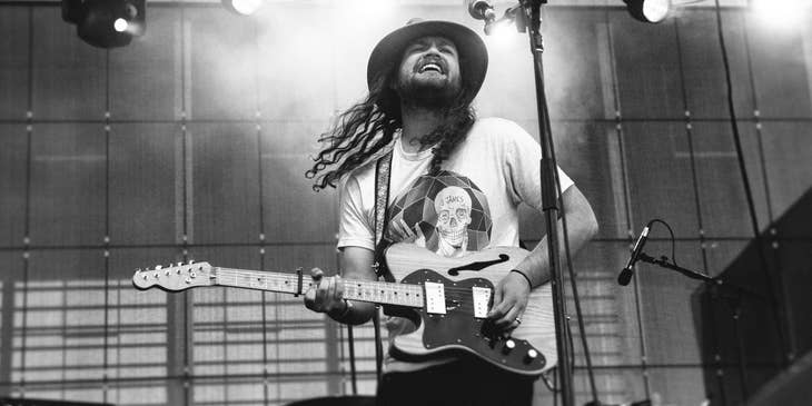 Guitarist performing a guitar solo at a concert