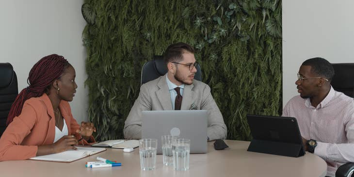 A Female Headhunter having a meeting with hiring managers.