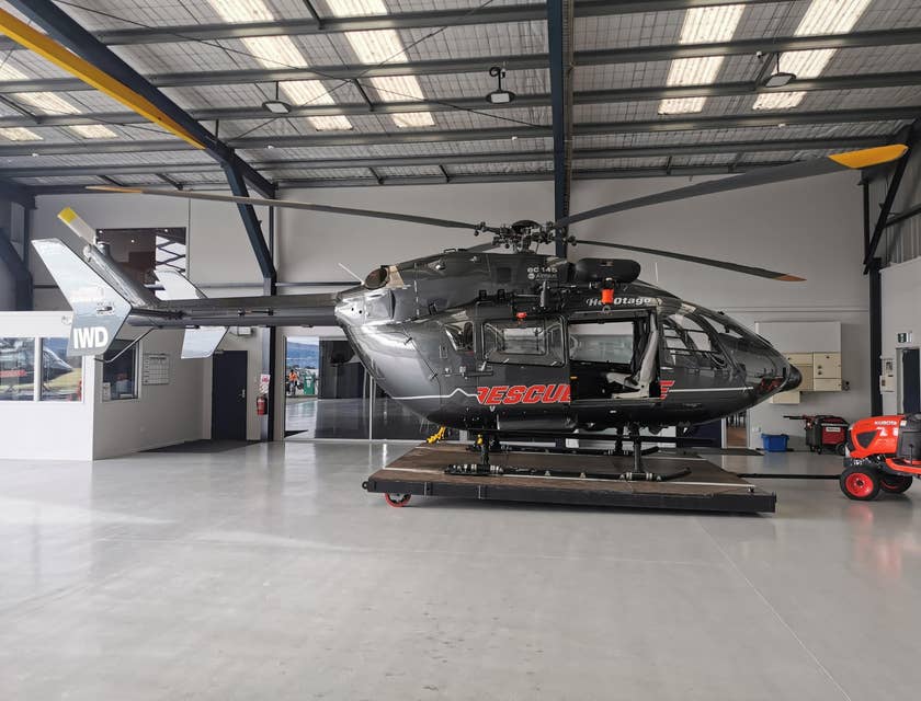 black helicopter parked in a garage