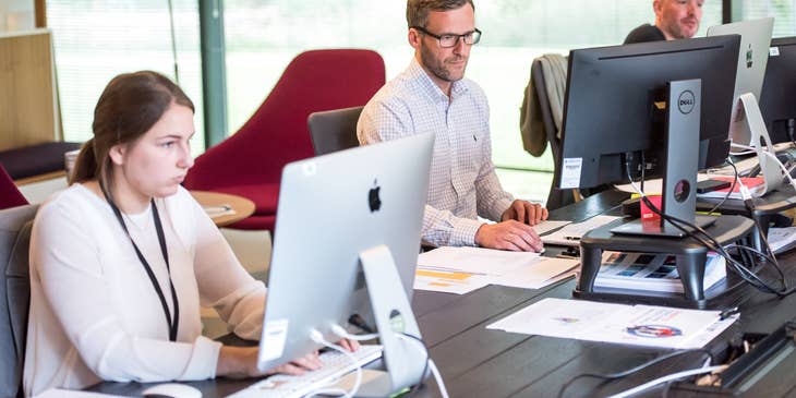 a team of Help Desk Technicians providing technical assistance to clients remotely