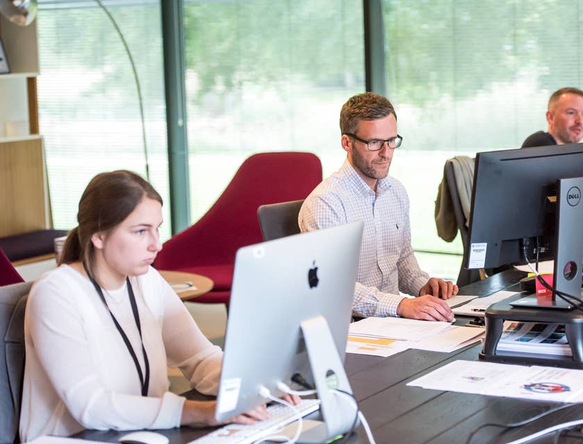 a team of Help Desk Technicians providing technical assistance to clients remotely