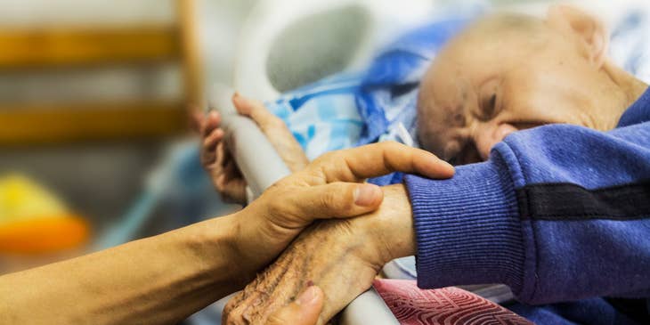 Home Care Nurse testing for muscle weakness.
