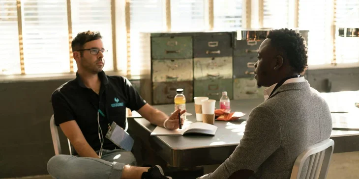 A hotel manager discussing to his staff.