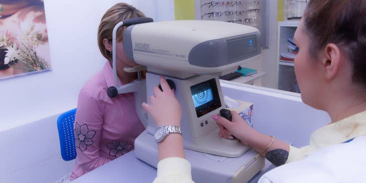 optometrist conducting eye exam